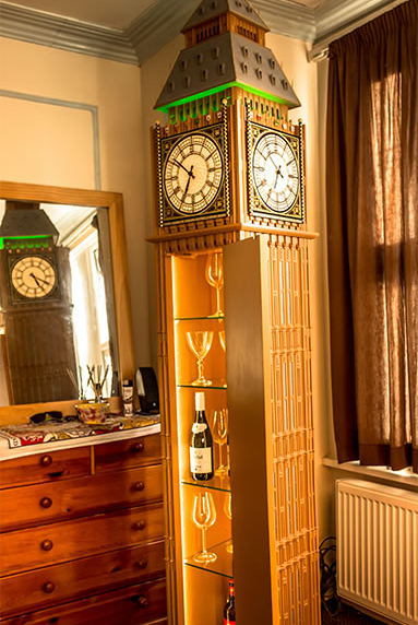 photo of WestminsterClock in the room door open, reflected in the mirror